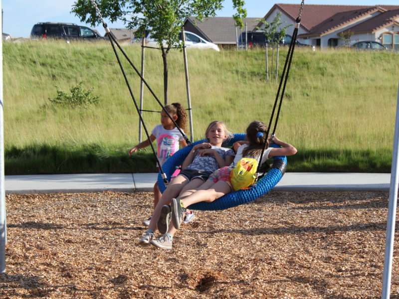 families playing at hillside park