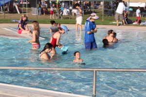 families swimming at lincoln village pool